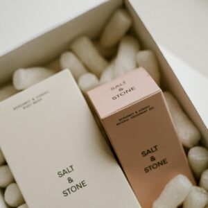 Top view of Salt & Stone cosmetic products in elegant packaging, ideal for lifestyle and beauty stock photos.